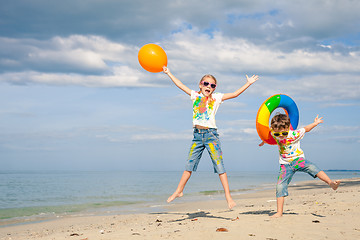 Image showing Happy children playing on the beach at the day time.