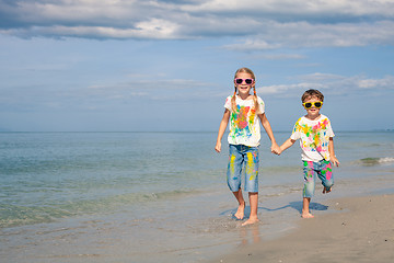 Image showing Happy children playing on the beach at the day time.