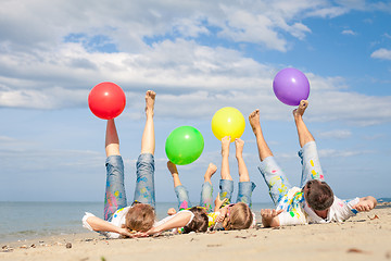 Image showing Happy family playing on the beach at the day time.