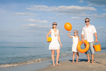 Image showing Happy family playing on the beach at the day time.