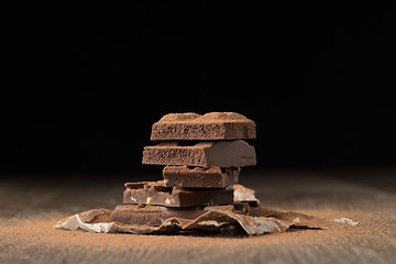 Image showing Chocolate on paper at table