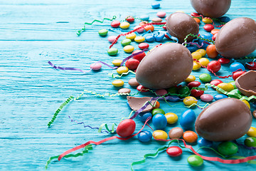 Image showing Chocolate eggs, jelly beans, ribbons