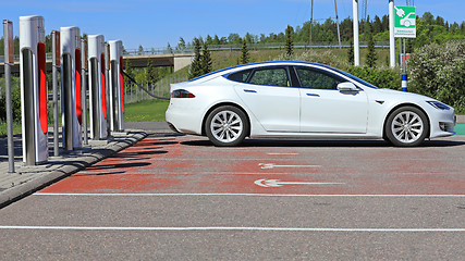 Image showing White Tesla Model S Electric Car Charging Battery