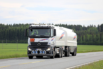 Image showing White Mercedes-Benz Actros Fuel Tank Truck on Summer Road