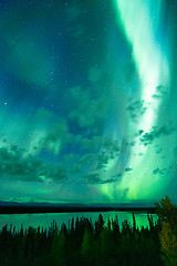 Image showing Lake Reflects Aurora Borealis Emerging Through Clouds Remote Ala