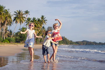 Image showing Happy family playing on the beach at the day time.