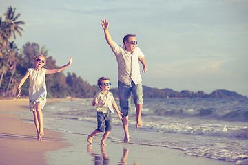 Image showing Happy children playing on the beach at the day time.