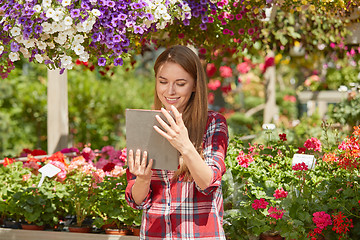 Image showing Gardener using tablet