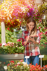 Image showing Gardener using tablet