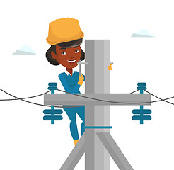 Image showing Electrician working on electric power pole.