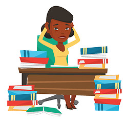 Image showing Student sitting at the table with piles of books.