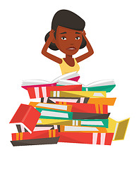 Image showing Student sitting in huge pile of books.