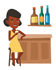 Image showing Woman sitting at the bar counter.