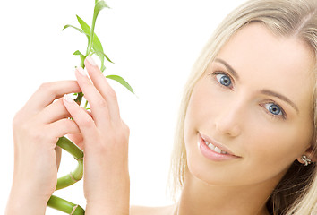 Image showing happy blonde with bamboo