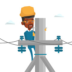 Image showing Electrician working on electric power pole.