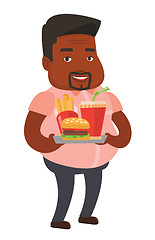 Image showing Man holding tray full of fast food.