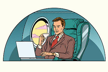 Image showing businessman working in the business class cabin