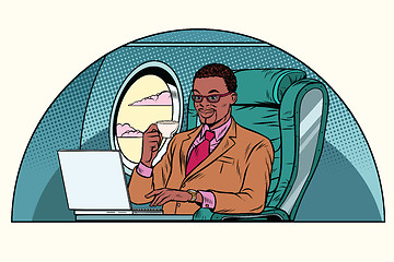 Image showing businessman working in the business class cabin