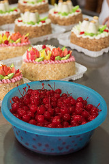 Image showing Bowl of cherry on cake production