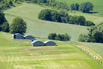 Image showing huts in the green meadow