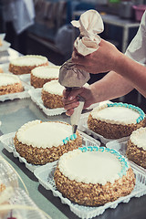 Image showing Manual cakes production