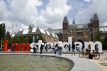 Image showing editorial tourists at i amsterdam sign by rijksmuseum amsterdam
