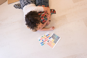 Image showing Happy young couple relaxing after painting