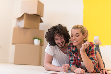 Image showing Happy young couple relaxing after painting