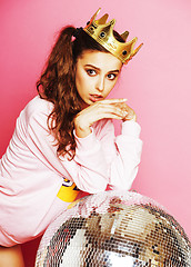 Image showing young cute disco girl on pink background with disco ball and cro