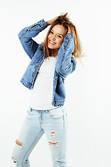 Image showing young pretty teenage hipster girl posing emotional happy smiling on white background, lifestyle people concept 