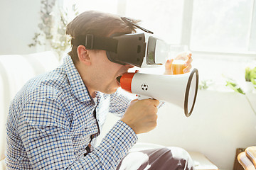 Image showing The man with glasses of virtual reality. Future technology concept.