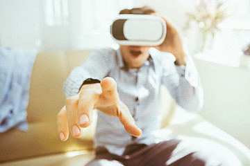 Image showing The man with glasses of virtual reality. Future technology concept.