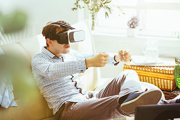 Image showing The man with glasses of virtual reality. Future technology concept.