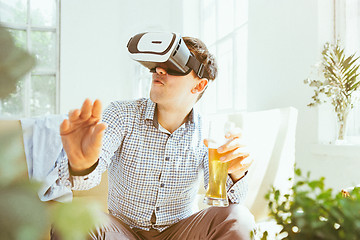 Image showing The man with glasses of virtual reality. Future technology concept.