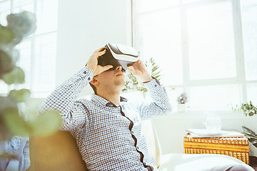 Image showing The man with glasses of virtual reality. Future technology concept.