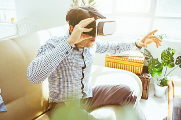 Image showing The man with glasses of virtual reality. Future technology concept.