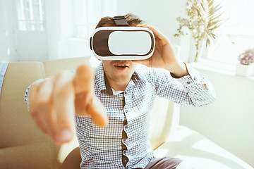 Image showing The man with glasses of virtual reality. Future technology concept.