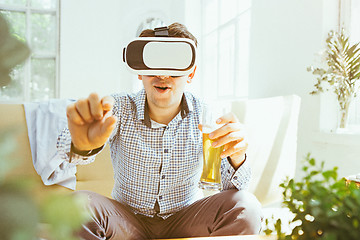 Image showing The man with glasses of virtual reality. Future technology concept.