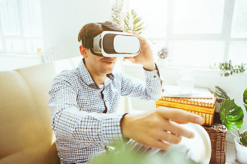 Image showing The man with glasses of virtual reality. Future technology concept.