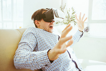 Image showing The man with glasses of virtual reality. Future technology concept.