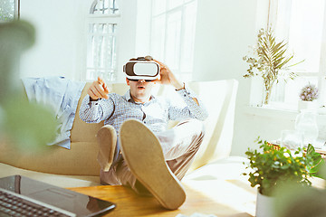 Image showing The man with glasses of virtual reality. Future technology concept.