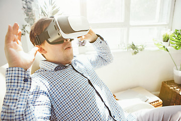 Image showing The man with glasses of virtual reality. Future technology concept.