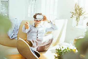 Image showing The man with glasses of virtual reality. Future technology concept.