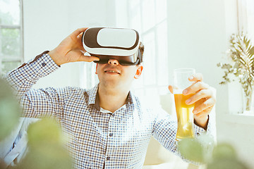 Image showing The man with glasses of virtual reality. Future technology concept.