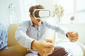 Image showing The man with glasses of virtual reality. Future technology concept.