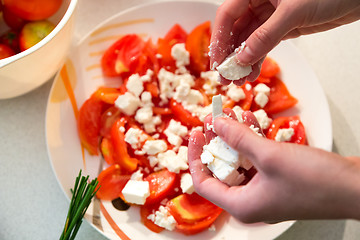 Image showing Making of tomato salad with feta cheese.