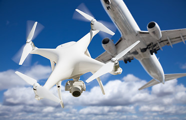 Image showing Unmanned Aircraft System (UAV) Quadcopter Drone In The Air Too C