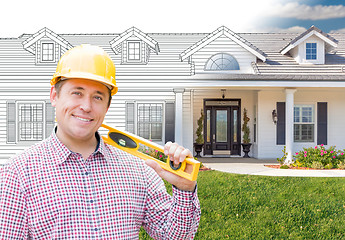 Image showing Male Contractor Wearing Hard Hat In Front of House Drawing Grada
