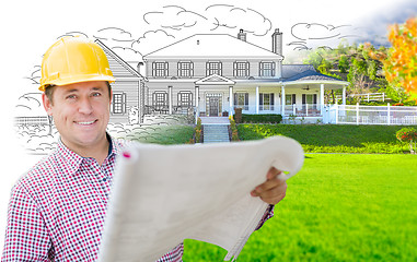 Image showing Male Contractor Wearing Hard Hat In Front of House Drawing Grada