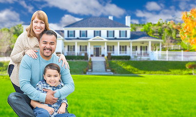 Image showing Mixed Race Family In Front Yard of Beautiful House and Property.